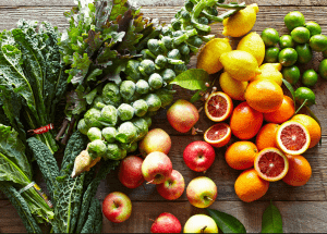 a group of fruits and vegetables on a wood surface Healthy Weight Loss Diets Tong